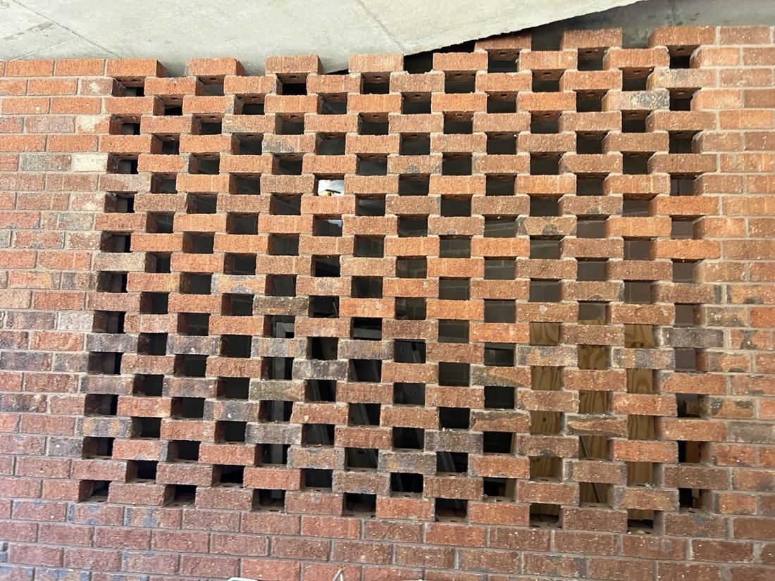 Close-up of a red face brick hit-and-miss screen wall